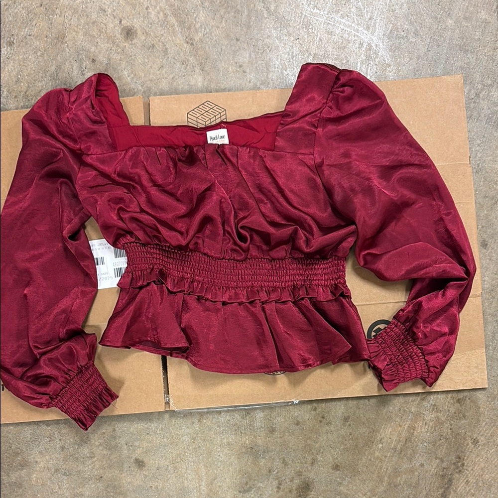 Peach Love California Red Puff Sleeve Blouse with Ruffled Hem and Smocked Waist